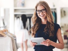 How To Judge Abilities Of Buyers Advocate girl standing with tablet and smiling
