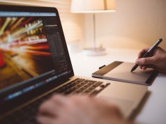 Professionalism in a Website Design Company writing tab and laptop