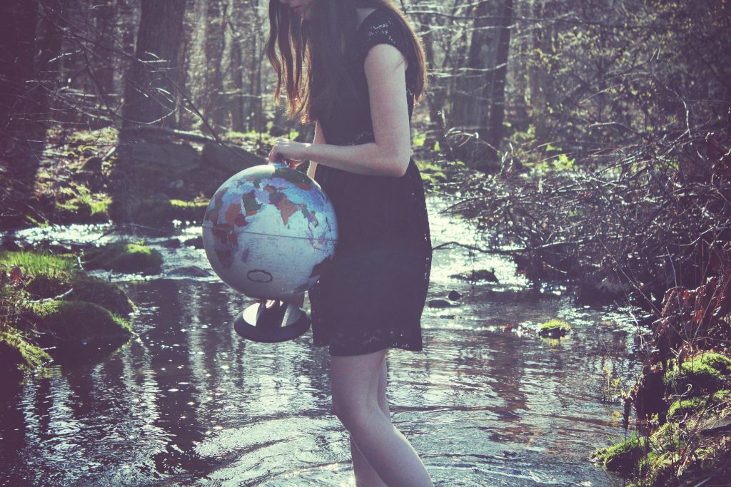 A person standing next to a tree