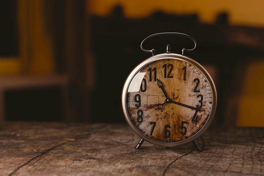 A close up of a clock in the middle of a watch