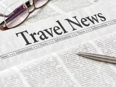 Travel News A close up of a newspaper