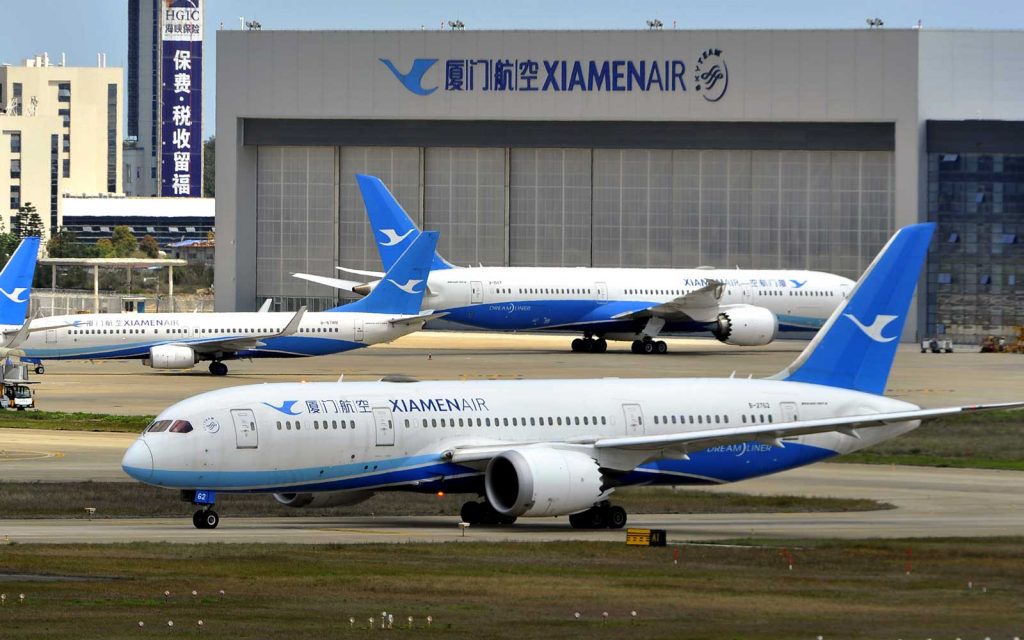 A large passenger jet sitting on top of a runway