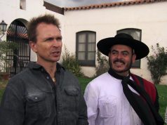“The Amazing Race” in Paraguay! Phil Keoghan standing in front of a building