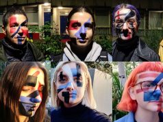 Goodbye mante 2011! A group of people standing on a mask