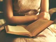 Ahata ayu A person sitting on a bed